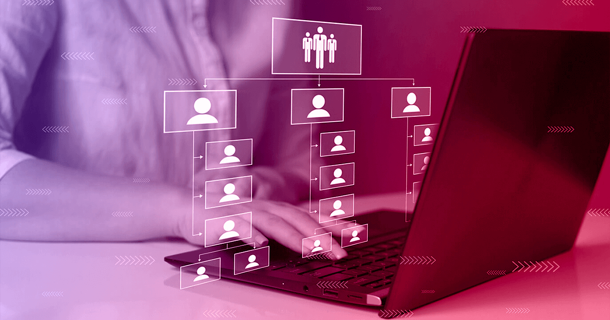 An image of a man using a laptop showing a visualization of an org structure.